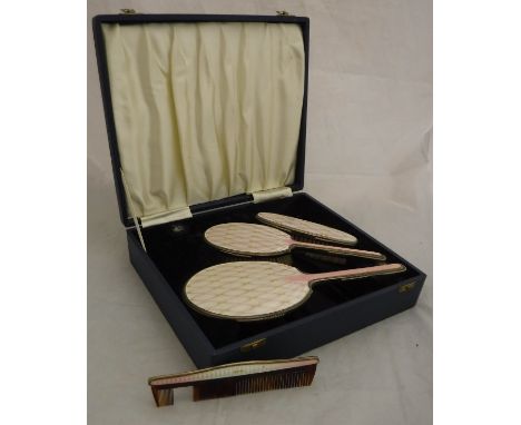 A mid 20th Century silver and enamel four part dressing table vanity set, to include two brushes, mirror and comb, housed in 