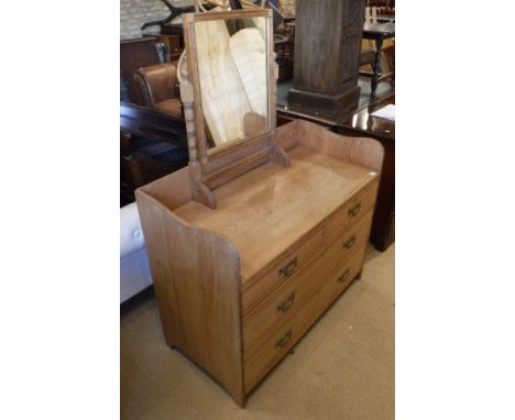 A Victorian ash dressing chest, the dressing mirror above a three quarter galleried top above two short and two long drawers