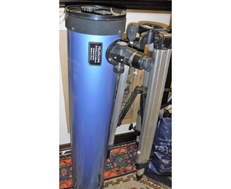 A Sky Watcher telescope and tripod, together with AFTER DENBY FADLER "Couple by fireside winding wool", black and white engra