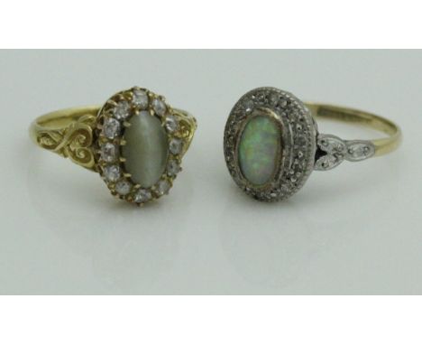 A 22 carat gold, jade and diamond ring, together with an 18 carat gold platinum set opal and diamond ring (2) CONDITION REPOR