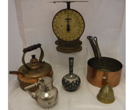 A set of three graduated copper saucepans with iron handles, a copper kettle, an Islamic onion shaped pot with white metal in