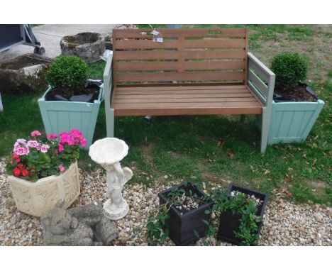 A Florenite painted garden bench, together with a painted bird table, a pair of painted wooden planters, each with box bush, 