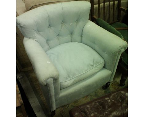 A 19th Century tub chair with button back and duck egg blue upholstery raised on square tapering front legs to brass caps and