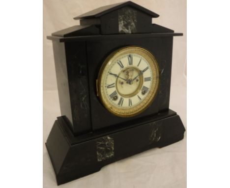 A black slate mantle clock with Roman numerals to the enamel dial