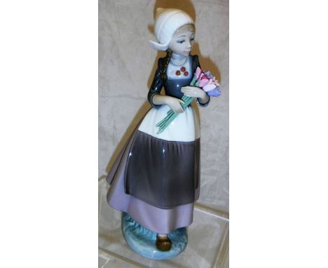 A Lladro figurine of  "A Dutch girl with tulips"