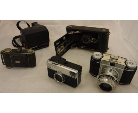A box of assorted vintage cameras to include examples by Kodak and Paxina, etc