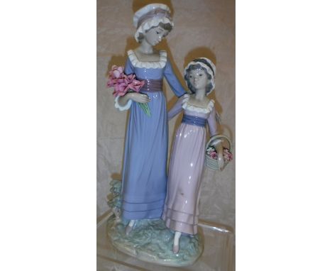 A Lladro figural group of "A lady with child carrying flowers"