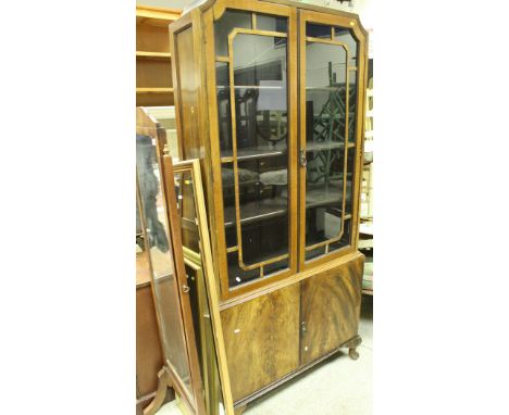 A 1930's walnut bookcase cabinet, the glazed top above two cupboard doors, together with a Victorian Prie à Dieu chair, a 20t