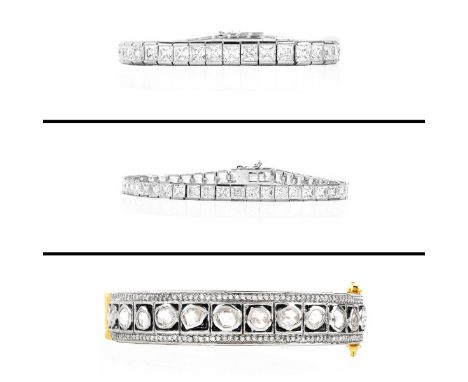 Three (3) Pieces Sterling And CZ Fashion Jewelry. Includes 2 Line Bracelets, One Hinged Bangle. Signed. Domestic Shipping: 28