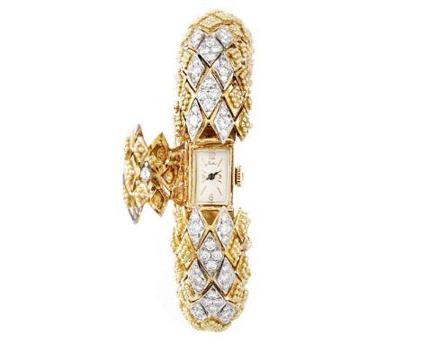 Vintage Buhre Pave Set Round Brilliant Cut Diamond and 18 Karat Yellow Gold Bangle Bracelet Watch. Signed to dial. Measures 1
