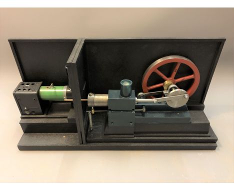 A two-part live steam engine mounted on plinth, height 31cm.