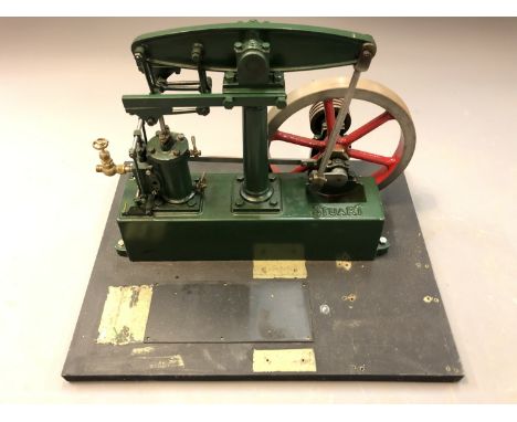 A live steam Stuart beam engine on plinth, height 29cm. 