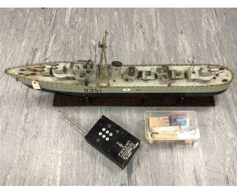 A remote control model of an M Class Destroyer D351 Meteor (length 123cm), together with an RC hand set and a box of parts.