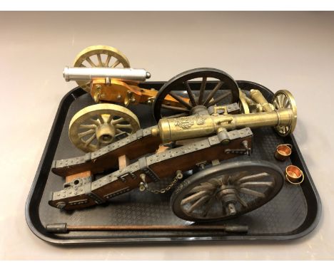 Three wooden and metal model cannons. 