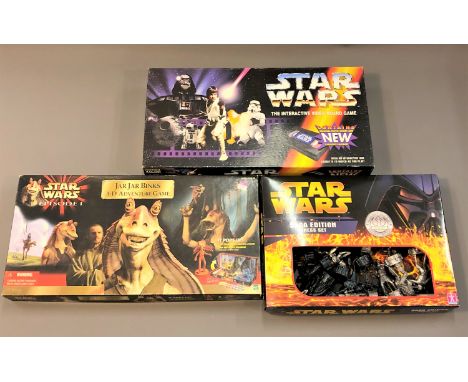 A collection of Star Wars games including Star Wars Saga Edition Monopoly, in original retail packaging, Star Wars Saga Editi