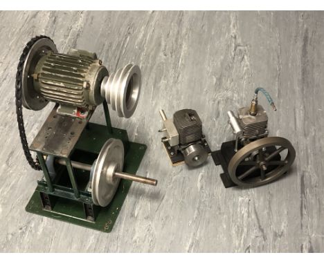Three engine components, tallest 42cm.