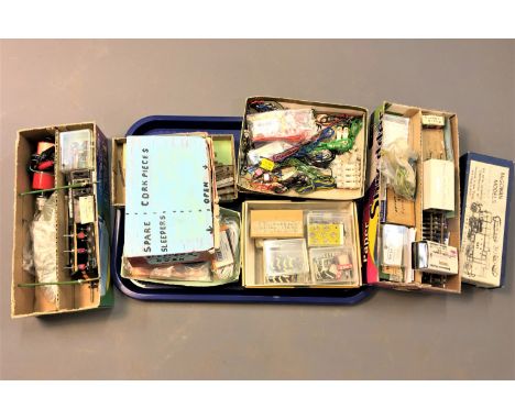 A large quantity of parts for model railway tinkering; cabling, switches, track, nuts and bolts, signs etc. (One tray)