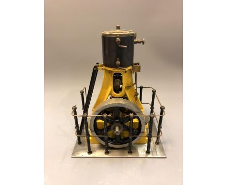 A vertical live steam piston engine, 24cm. 