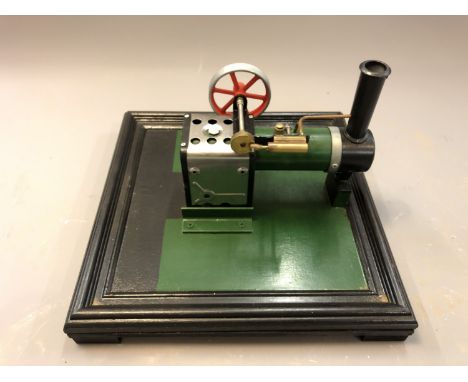 A live steam piston engine on plinth, length 31cm. 