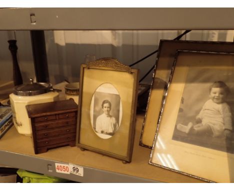 Shelf of collectables including photograph frames ceramics money box etc 