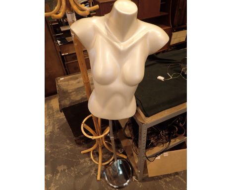 Female torso mannequin on stand