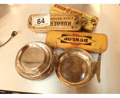 Three vintage puncture repair tins and a travelling curling tong heater