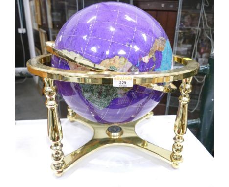 Purple desk top globe in brass coloured metal frame, +/- 40 cm high