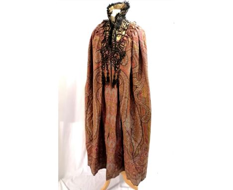 Antique paisley cloak with silk lining and a stiffened collar with feather trim and overlaid black brocade decoration. Large 