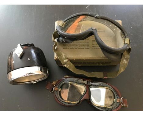 A pair of vintage leather padded frame glass goggles; a set of rubber frame 'Polaroid' goggles, with elastic strap and box; a