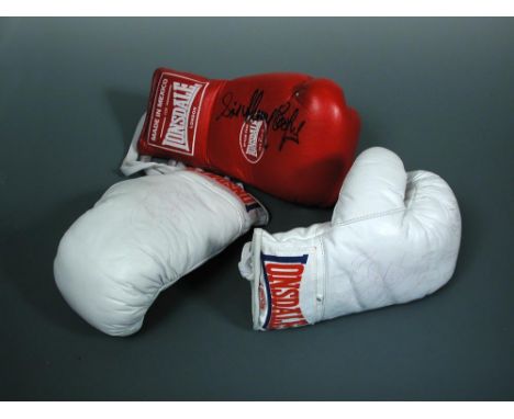 Boxing memorabilia. A pair of white Lonsdale sparring gloves, signed and indistinctly inscribed ‘Best Wishes … Sir Henry Coop