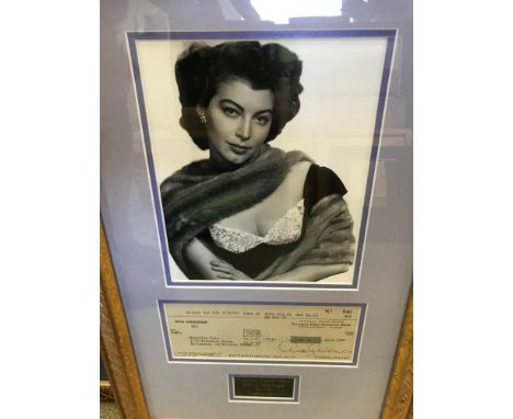 A framed bank cheque signed by Ava Gardner, drawn on Security First national Bank, dated 7/31/67, in favour of Beatrice Cole,