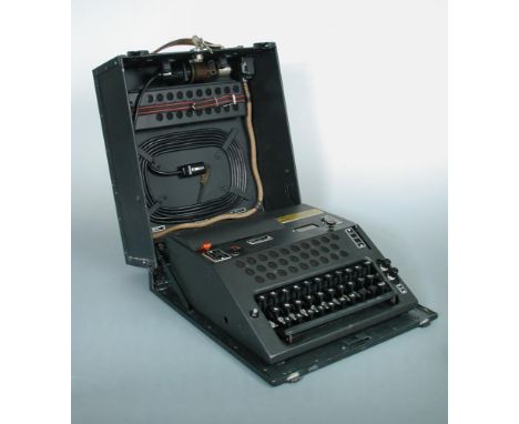 A Nema Cipher machine, circa 1948, serial number TD610, with four double bearing rotors, and two single rotors, including red