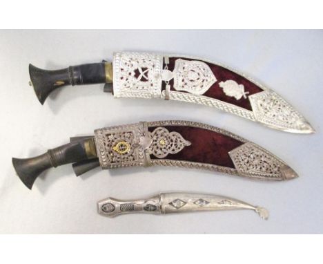 Two late 20th century presentation kukris,  the scabbards with white metal mounts, one with Elizabeth II crest, together with