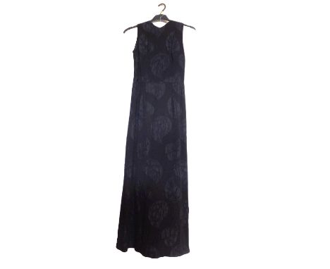 A c.1960's black shift evening dress, with crepe leaf design all over, open back with button fastening and bow detail to smal