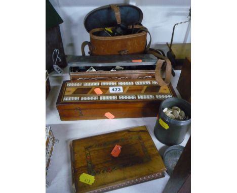 A TIN CONTAINING DOMINOES, a cribbage box, a tin of bone buttons, cased binoculars and a tourist postcard album 