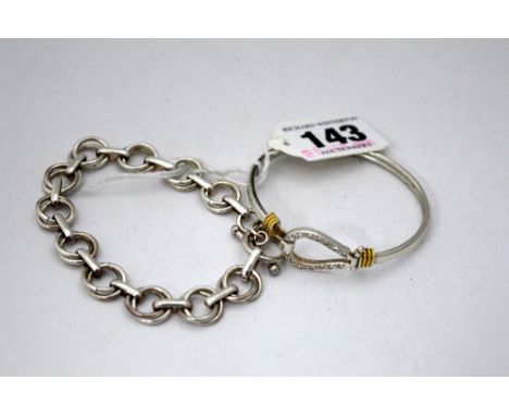 TWO FANCY BRACELETS, one as a torque bangle with cubic zirconia detail and one with fancy links 