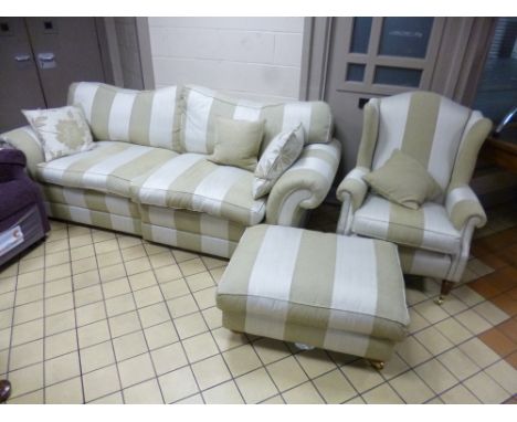 A THREE PIECE LOUNGE SUITE, with oatmeal striped upholstery, comprising settee, armchair and pouffe 