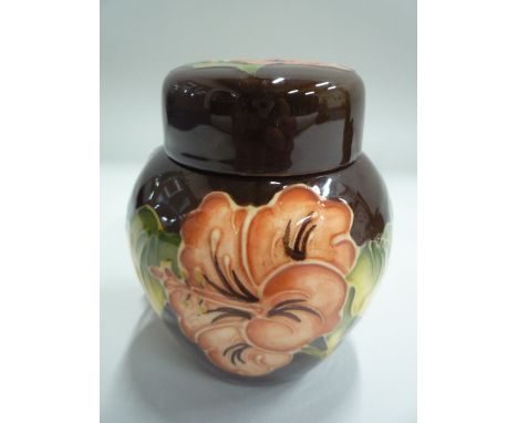 A SMALL MOORCROFT POTTERY GINGER JAR, 'Hibicus' pattern, impressed marks, height approximately 11cm 