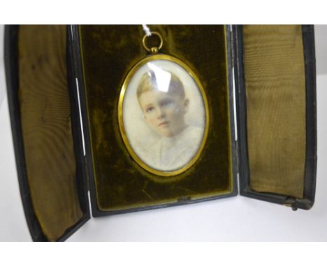 A CASED PORTRAIT, of a young boy