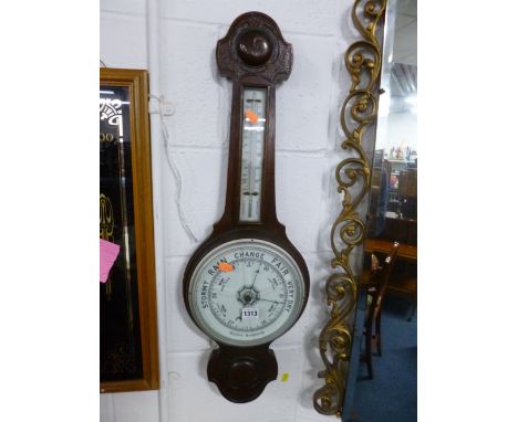 AN OAK CASED ANEROID BAROMETER (glass cracked) 