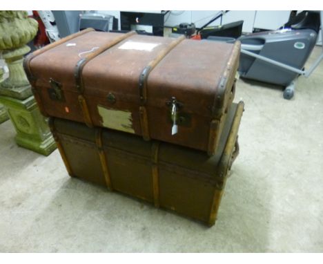 A LARGE TRAVELLING TRUNK, and a smaller travelling trunk (s.d.) (2) 