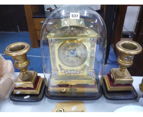 A FRENCH BRASS AND ENAMELLED CLOCK GARNITURE C1899, movement stamped 'Medaille d'Argent', the circular floral design champlev