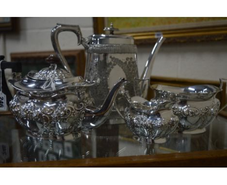 AN EMBOSSED DESIGN MATCHING THREE PIECE SILVER PLATED TEA SERVICE, together with a presentation coffee pot (4)