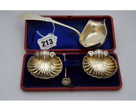 A CASED PAIR OF SILVER SHELL SALTS, on ball feet, Birmingham 1897, one spoon, together with sauce ladle stamped 813 (2)