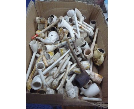 A QUANTITY OF CLAY PIPES, BOWLS, etc, to include figural, harp, foot kicking ball, claw designs, etc (mostly a/f) 