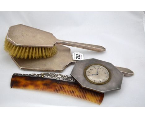 A SILVER MOUNTED ART DECO ENGINE TURNED MATCHING DRESSING TABLE MIRROR AND BRUSH, Birmingham 1936, together with silver mount