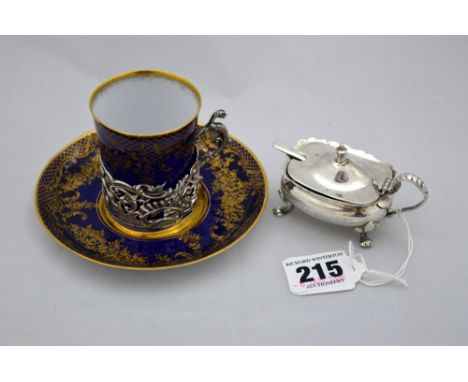 A SILVER MUSTARD, with blue glass liner on four shaped feet, Birmingham 1931, together with silver mounted Staffordshire coba