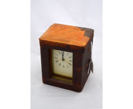 A CASED BRASS CARRIAGE CLOCK, with white enamelled dial, Roman numerals, bevelled glass, on bracket plinth with key, approxim