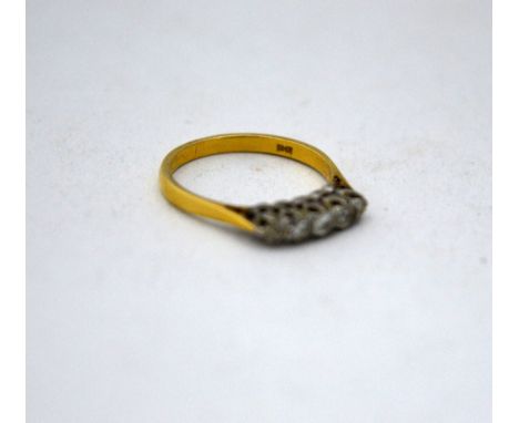 AN 18CT GOLD DIAMOND RING, with five graduated old cut diamonds to the plain tapered shank, hallmarks for London 