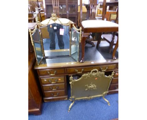 A GILT FRAMED TRIPLE MIRROR, and an ornate heavy brass firescreen (2) 
